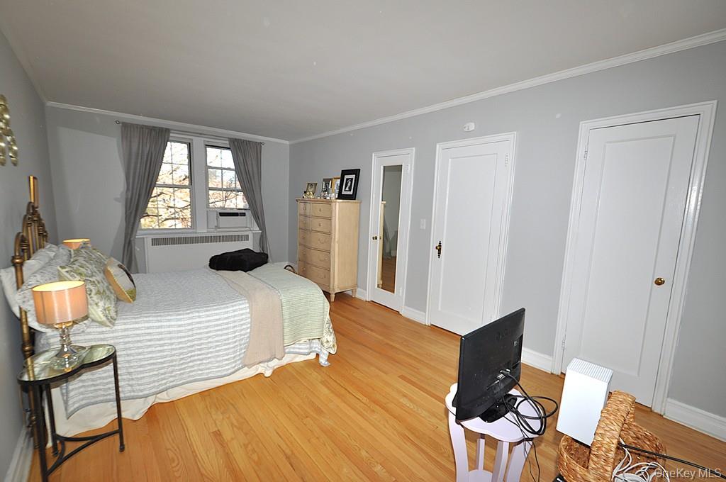 253 Garth Road, Unit 6J Scarsdale, NY 10583 - Photo 17 of 41 The oversized bedroom has stunning hardwood floors, can accommodate a king size bed, dresser, night stands and a comfy chair. The room is approx 202'-2" x 11'-3".