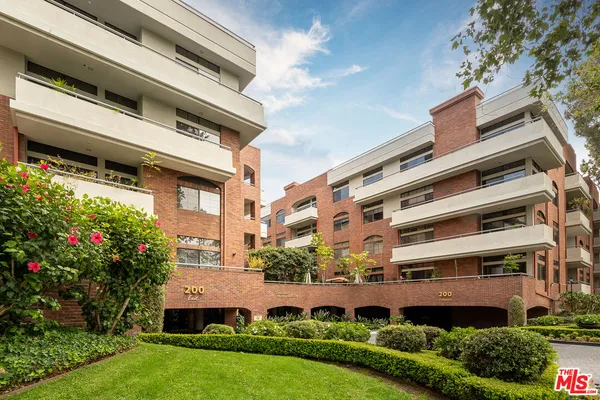 a building view with a garden space