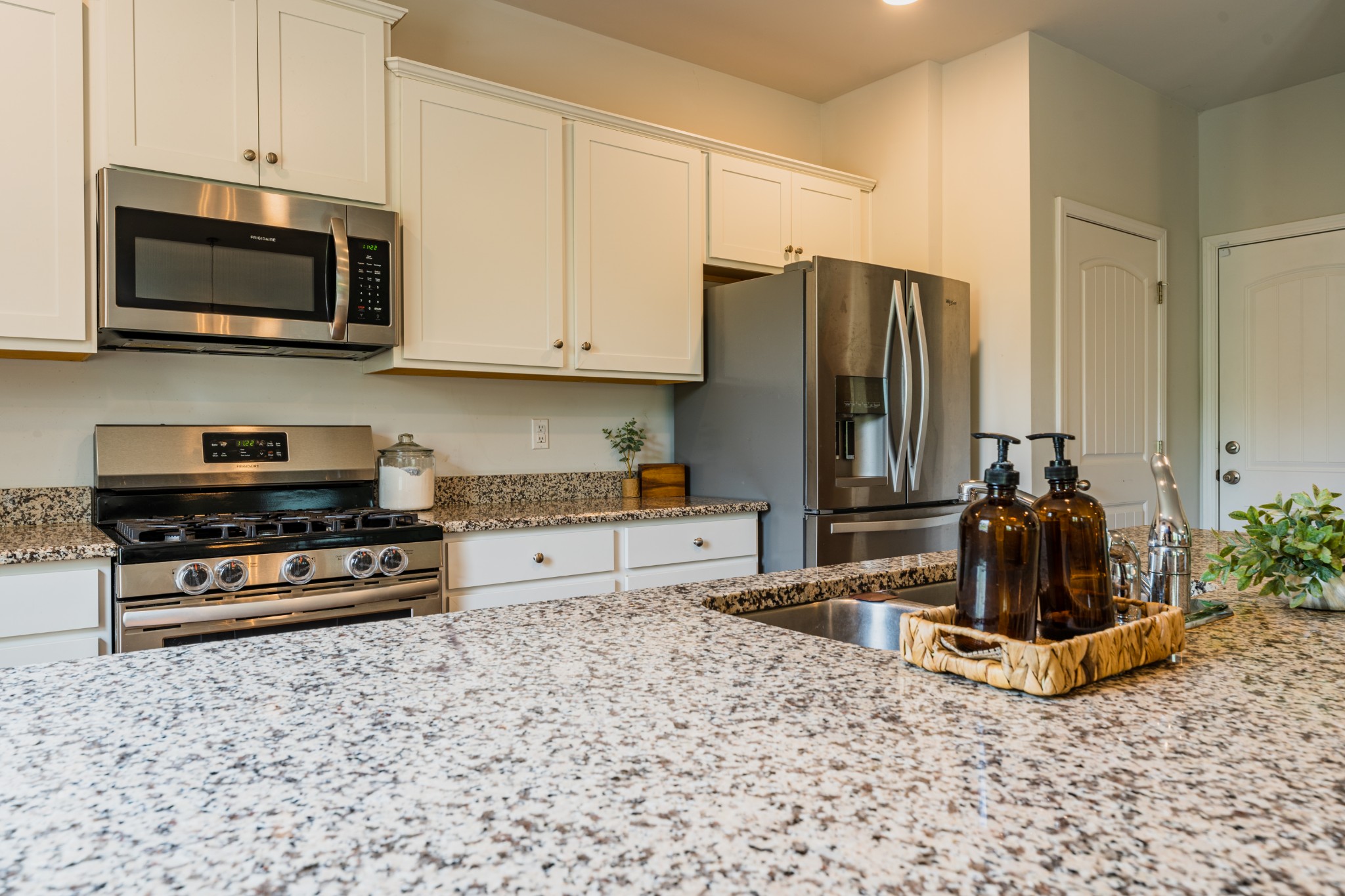 752 Prominence Road Columbia, TN 38401 - Photo 14 of 35 a kitchen with stainless steel appliances granite countertop a stove a sink and a microwave