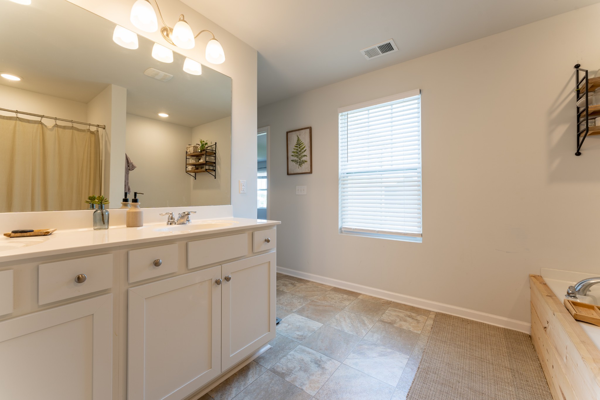 752 Prominence Road Columbia, TN 38401 - Photo 27 of 35 a bathroom with a sink vanity and mirror