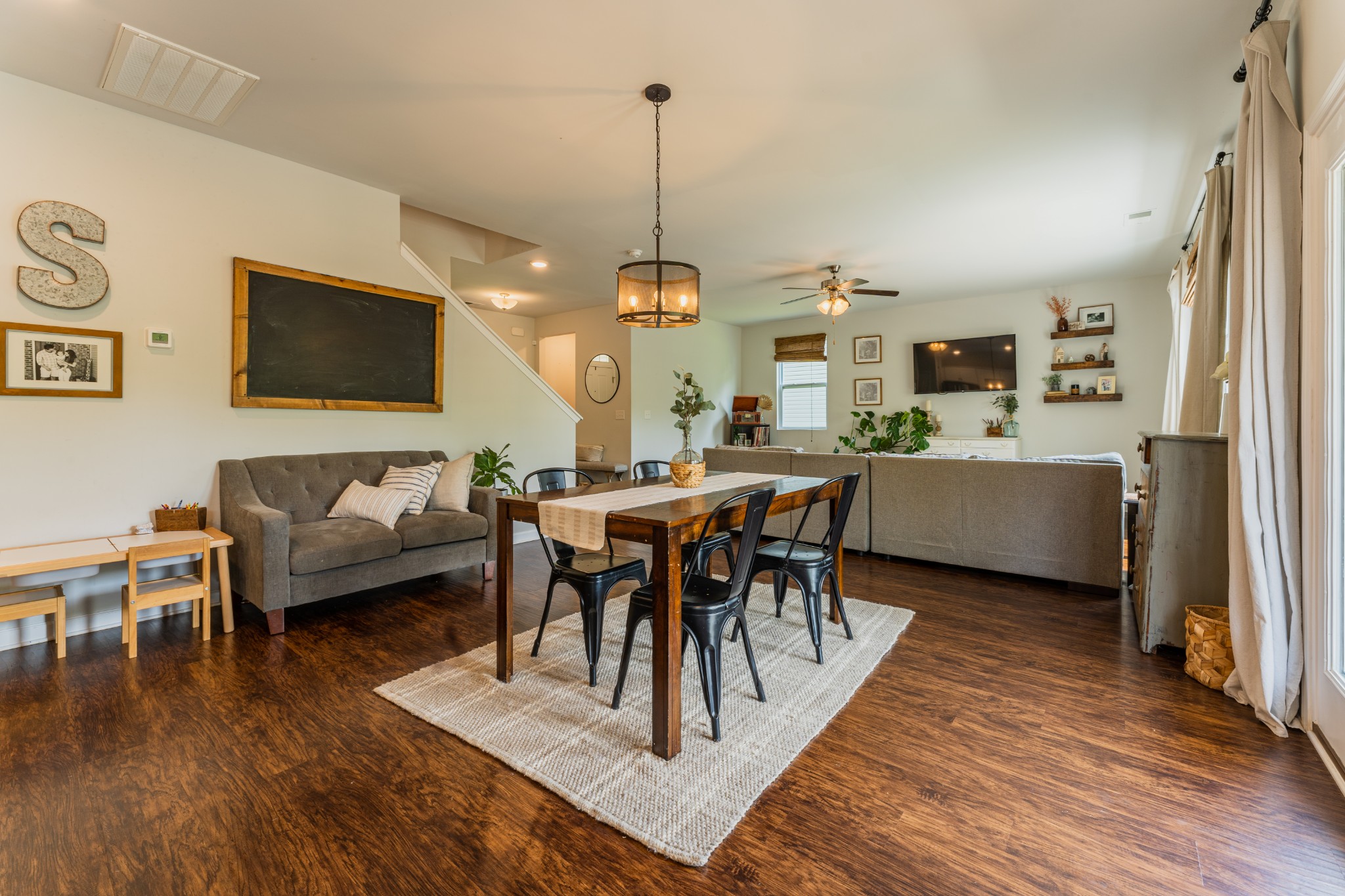 752 Prominence Road Columbia, TN 38401 - Photo 10 of 35 a living room with furniture a dining table and a flat screen tv