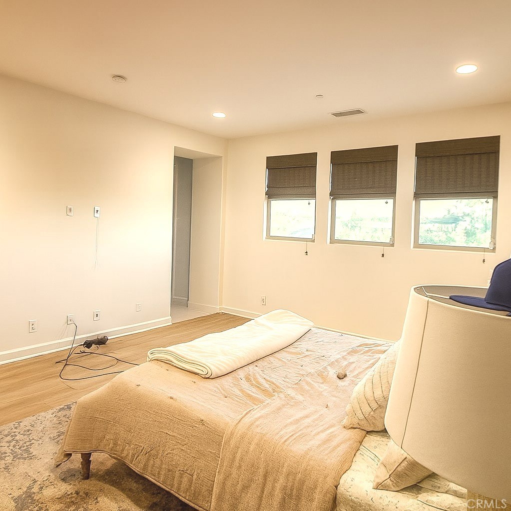279 Barnes Road Tustin, CA 92782 - Photo 20 of 31 a bed sitting in a spacious bedroom next to a window