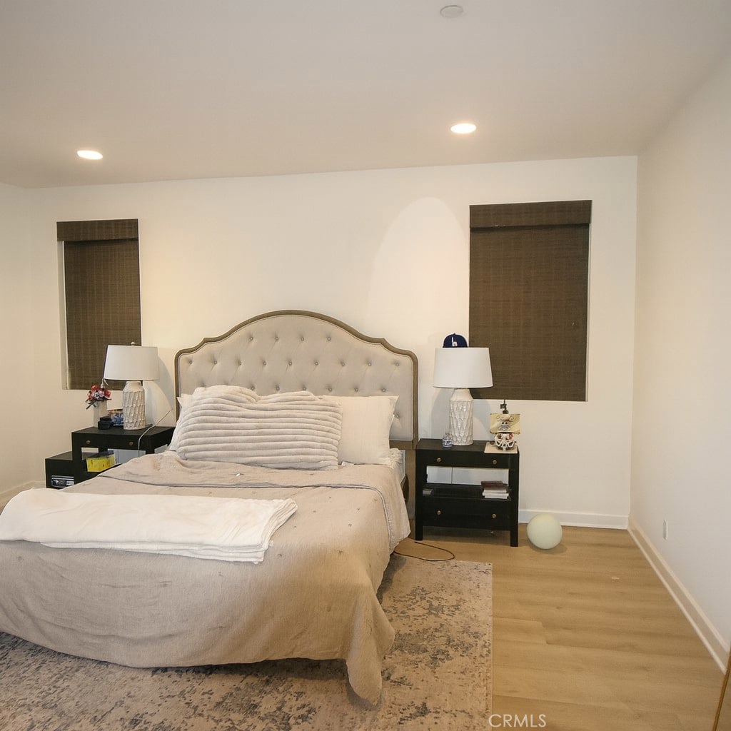 279 Barnes Road Tustin, CA 92782 - Photo 21 of 31 a bedroom with a bed and a table