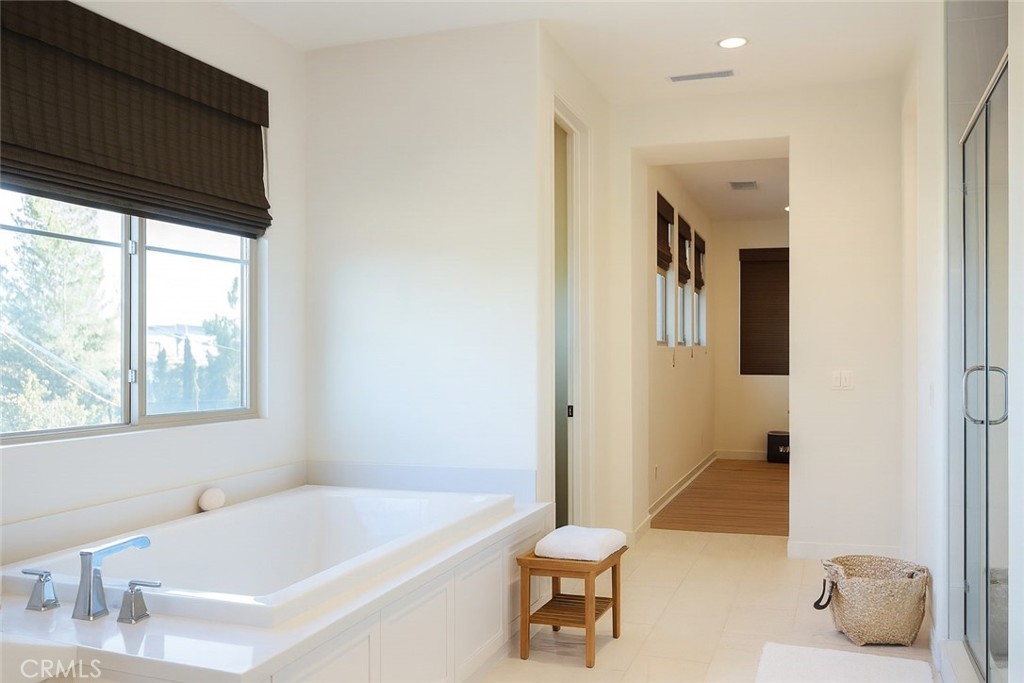 279 Barnes Road Tustin, CA 92782 - Photo 23 of 31 a bathroom with a tub a sink and a window