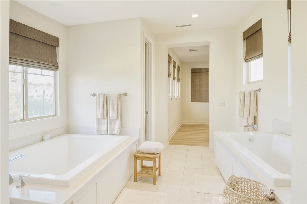 279 Barnes Road Tustin, CA 92782 - Photo 24 of 31 a bathroom with a bathtub and a shower