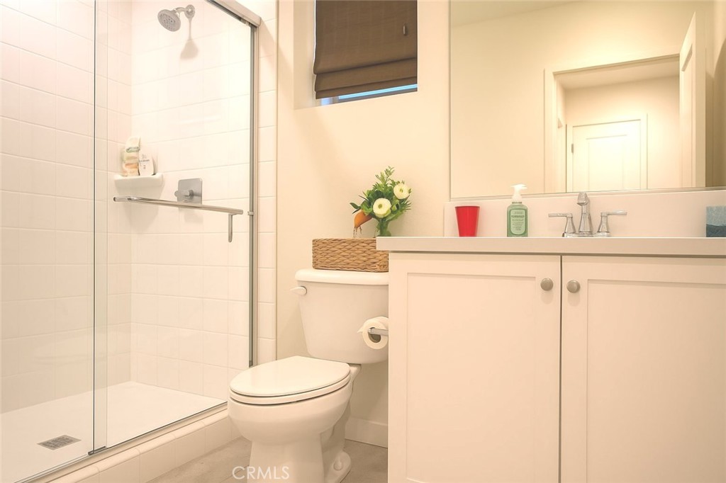 279 Barnes Road Tustin, CA 92782 - Photo 26 of 31 a bathroom with a sink a toilet and shower