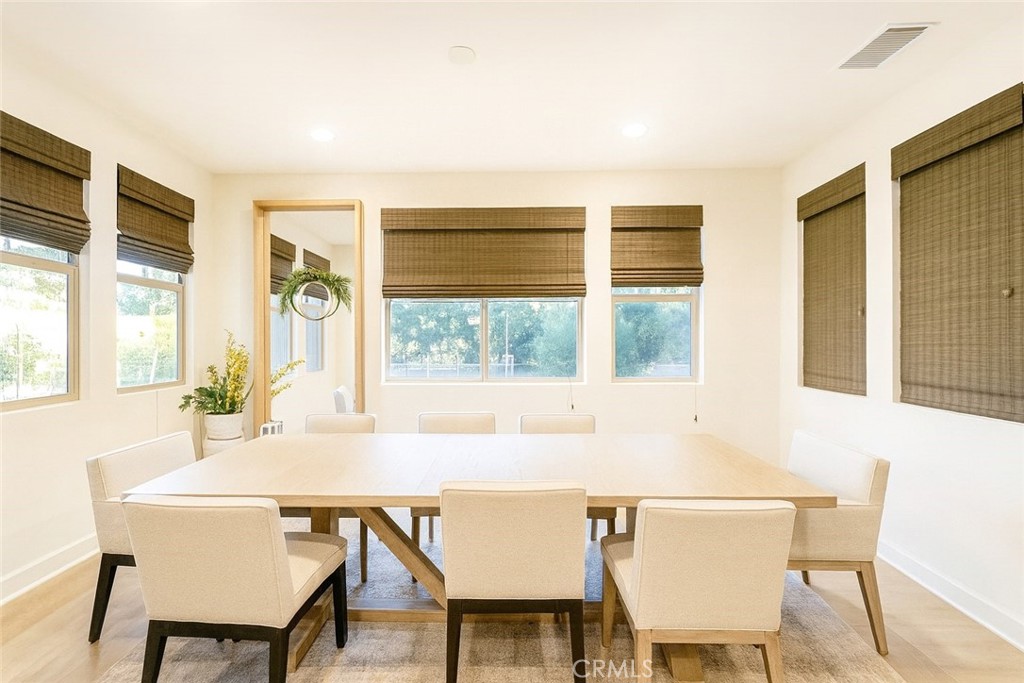 279 Barnes Road Tustin, CA 92782 - Photo 4 of 31 a view of a dining room with furniture and windows