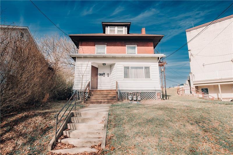 a house with trees in the background