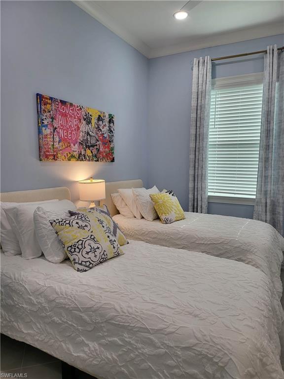 8920 Calypso Court Naples, FL 34113 - Photo 14 of 41 a bedroom with a bed and a window