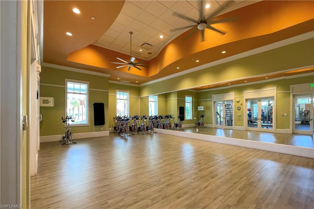8920 Calypso Court Naples, FL 34113 - Photo 38 of 41 a view of a lobby with furniture and wooden floor