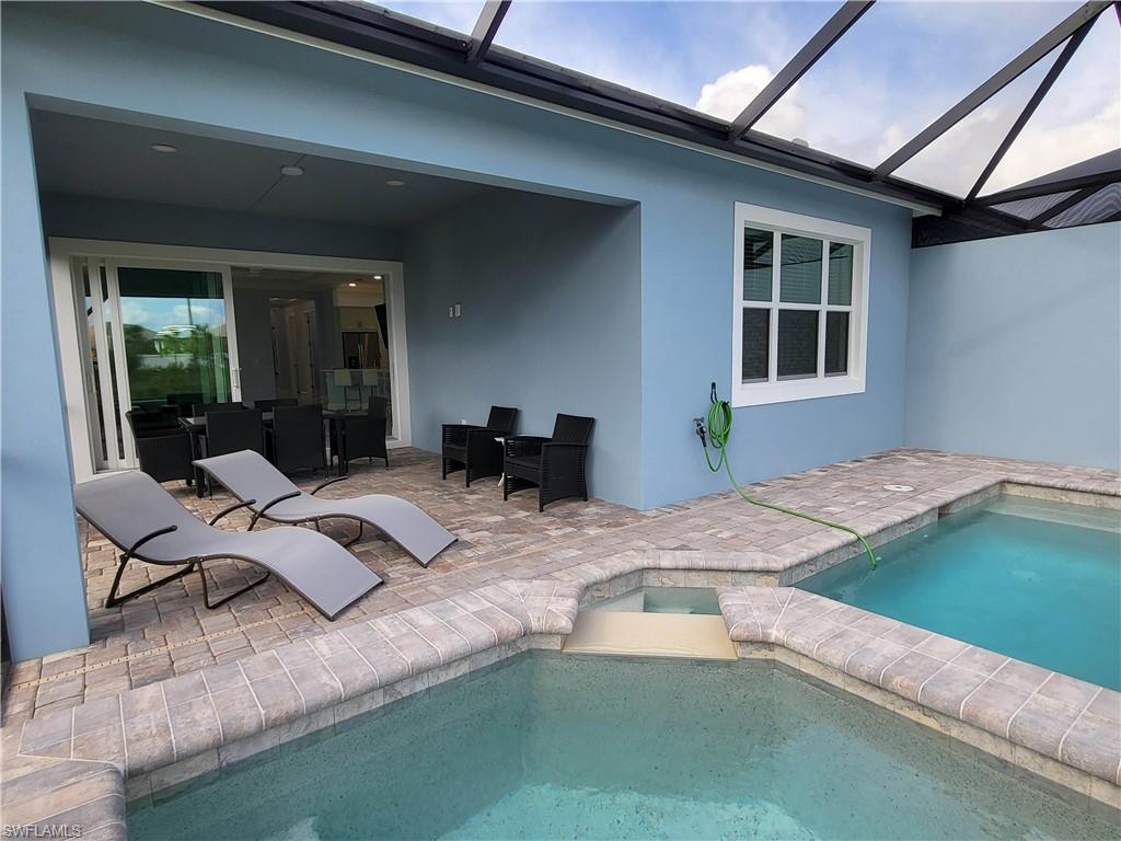 8920 Calypso Court Naples, FL 34113 - Photo 6 of 41 a outdoor space with lounge chair
