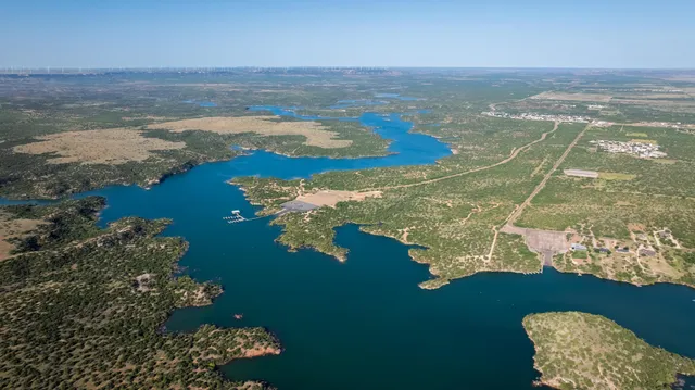 a large kitchen with a table and chairs