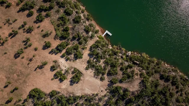a living room with furniture fireplace and a window