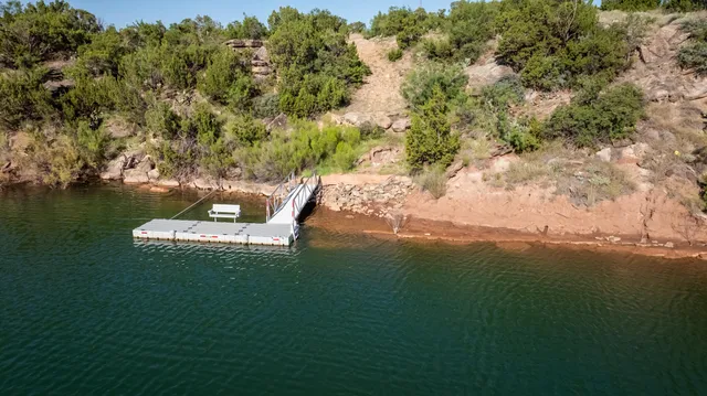 a room with furniture a rug and a window