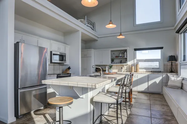 a bathroom with a toilet a sink and a mirror