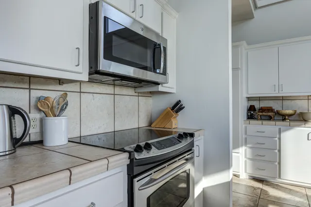 a view of living room and dining room with furniture