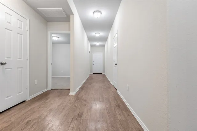 wooden floor in a hall with an entryway