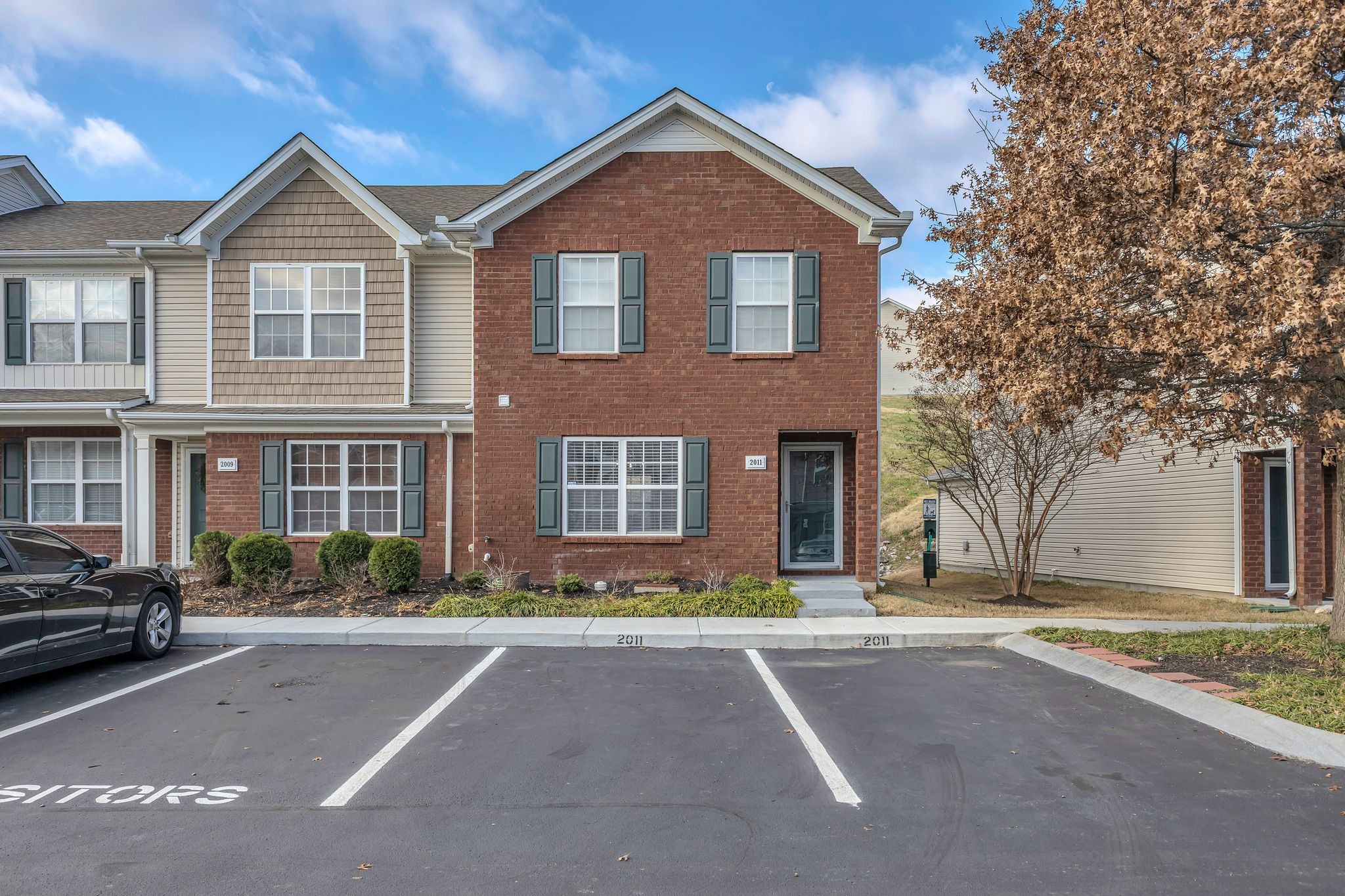 a front view of a house with a yard