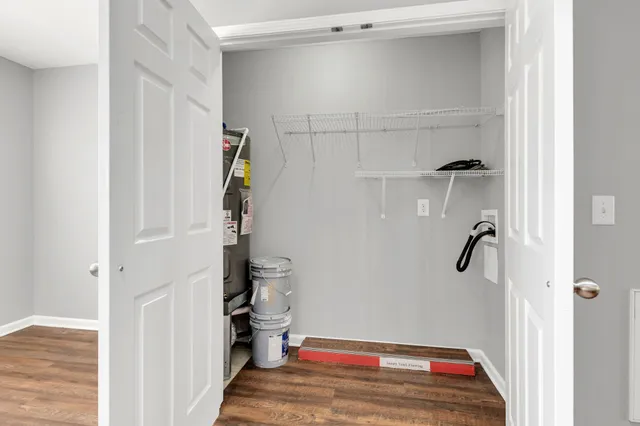 a view of walk in closet with empty racks