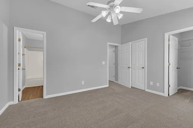 a view of an empty room with a bathroom