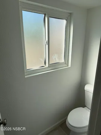 an empty room with windows and yard