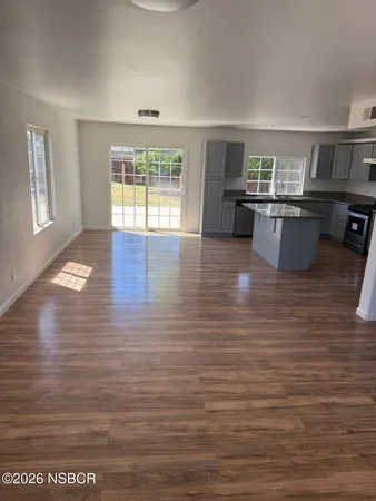 a view of kitchen with sink microwave and stove