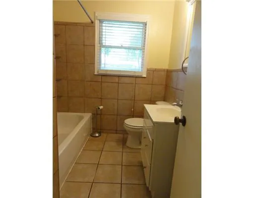 a bathroom with a sink a toilet and bathtub