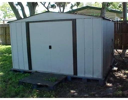 a view of backyard with potted plants
