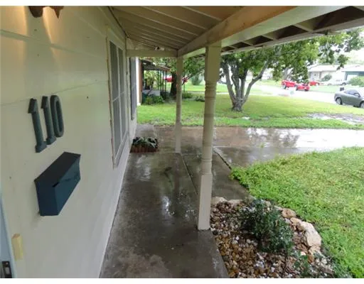 a view of backyard with potted plants