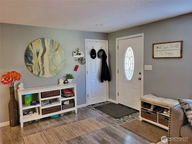 a room with furniture and wooden floor