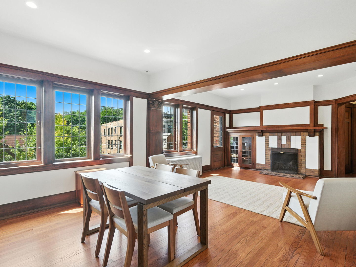 1368 East 57th Street, Unit 3 Chicago, IL 60637 - Photo 4 of 12 a living room with furniture a wooden floor and a large window