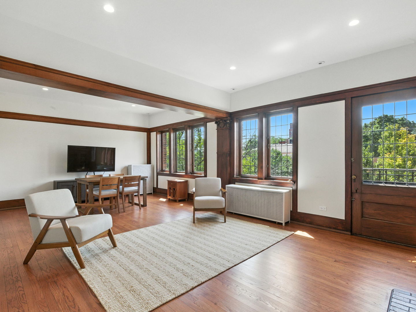 1368 East 57th Street, Unit 3 Chicago, IL 60637 - Photo 5 of 12 a living room with furniture and a flat screen tv
