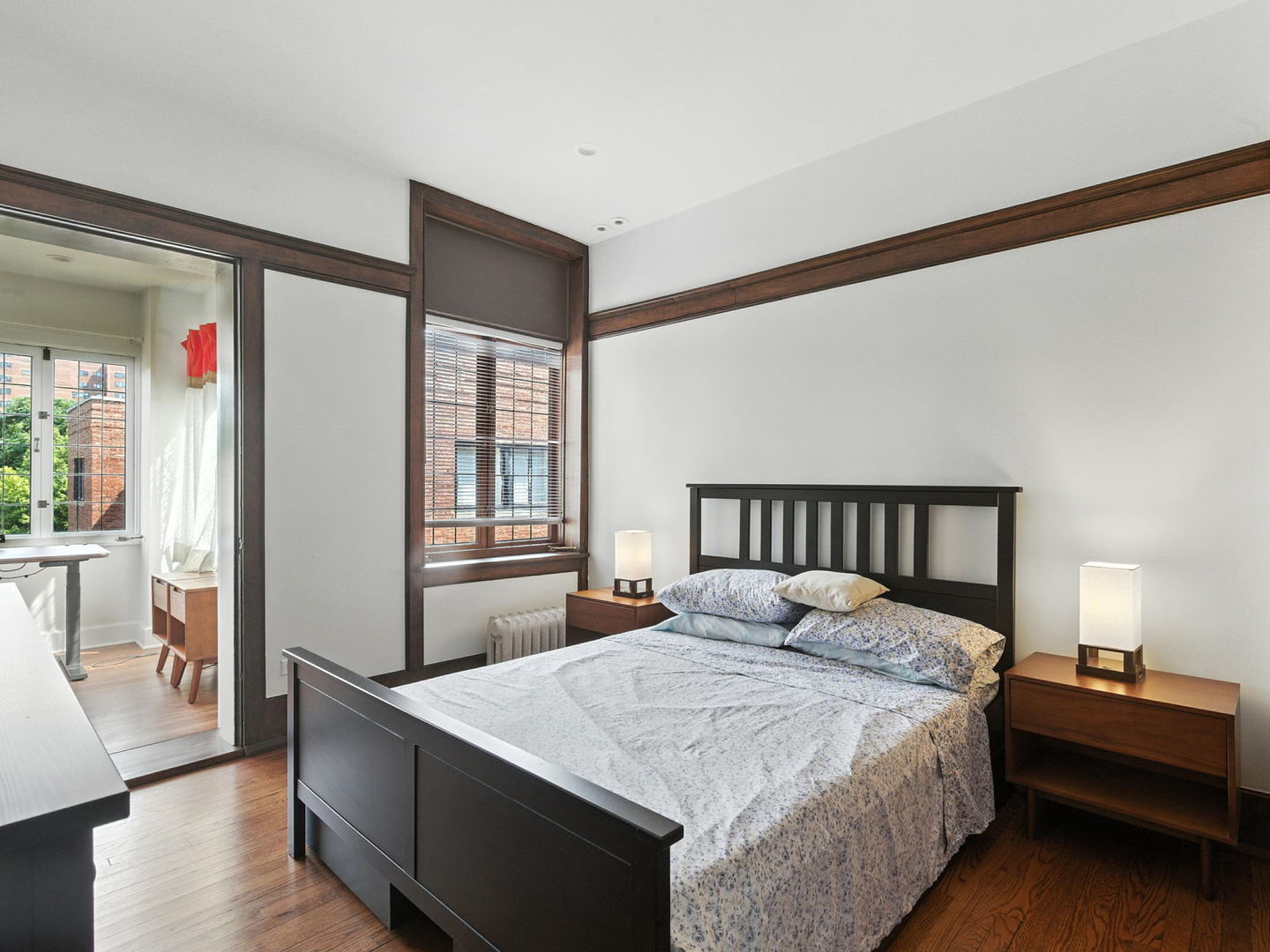 1368 East 57th Street, Unit 3 Chicago, IL 60637 - Photo 8 of 12 a bedroom with a large bed and a window