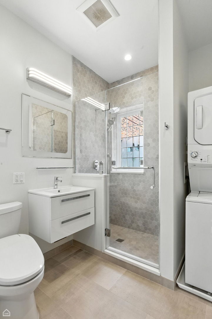 1368 East 57th Street, Unit 3 Chicago, IL 60637 - Photo 10 of 12 a bathroom with a toilet sink and shower