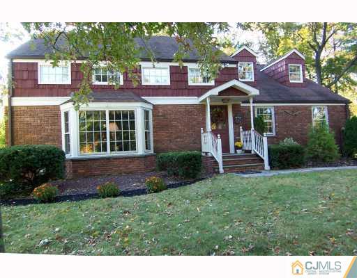 325 Chain O' Hills Road Colonia, NJ 07067 - Photo 1 of 10 a view of a house with a yard