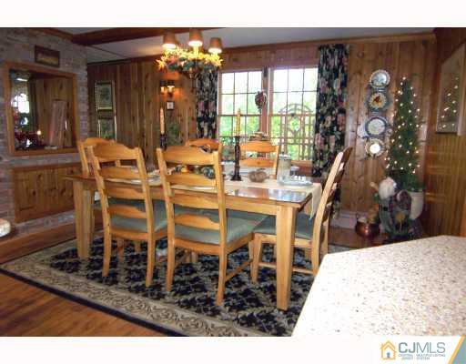 325 Chain O' Hills Road Colonia, NJ 07067 - Photo 3 of 10 a view of a dining room with furniture and chandelier