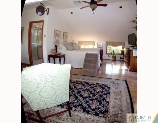 325 Chain O' Hills Road Colonia, NJ 07067 - Photo 7 of 10 a view of a living room and bathroom