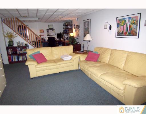 325 Chain O' Hills Road Colonia, NJ 07067 - Photo 8 of 10 a living room with furniture and a couch