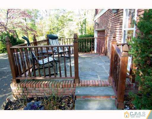 325 Chain O' Hills Road Colonia, NJ 07067 - Photo 9 of 10 a view of a chairs and table in the patio