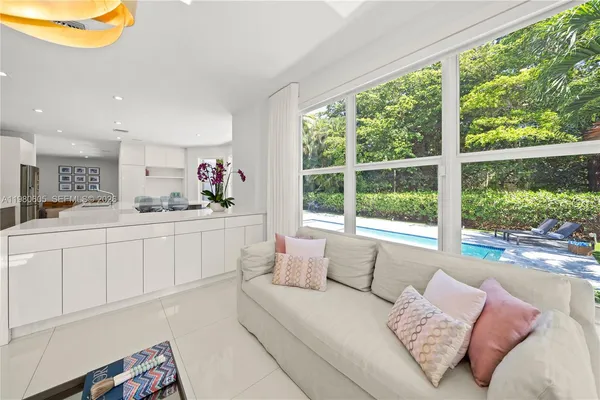a kitchen with stainless steel appliances a stove a microwave and white cabinets