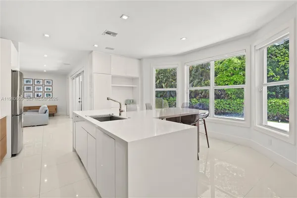 a view of kitchen with cabinets and wooden floor