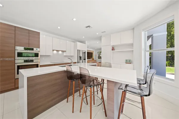 a view of a dining room with furniture window and outside view