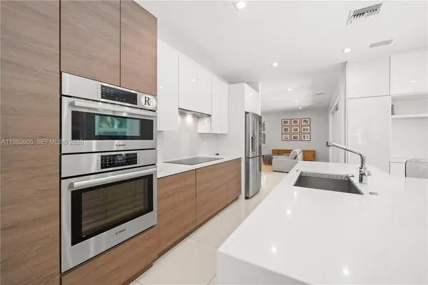 a view of kitchen with dining table and chairs
