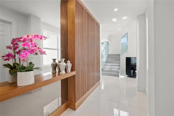 a living room with furniture and kitchen view
