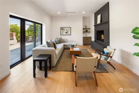 a living room with a couch and a floor to ceiling window
