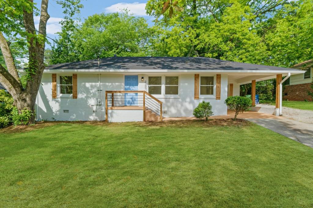 front view of a house with a yard