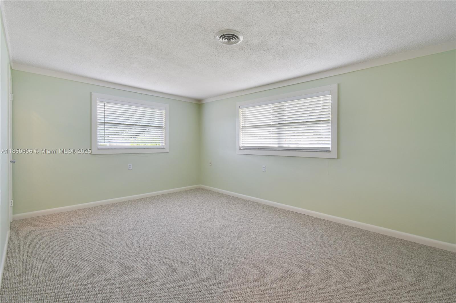 110 Windsor Road East Jupiter, FL 33469 - Photo 16 of 30 an empty room with a window