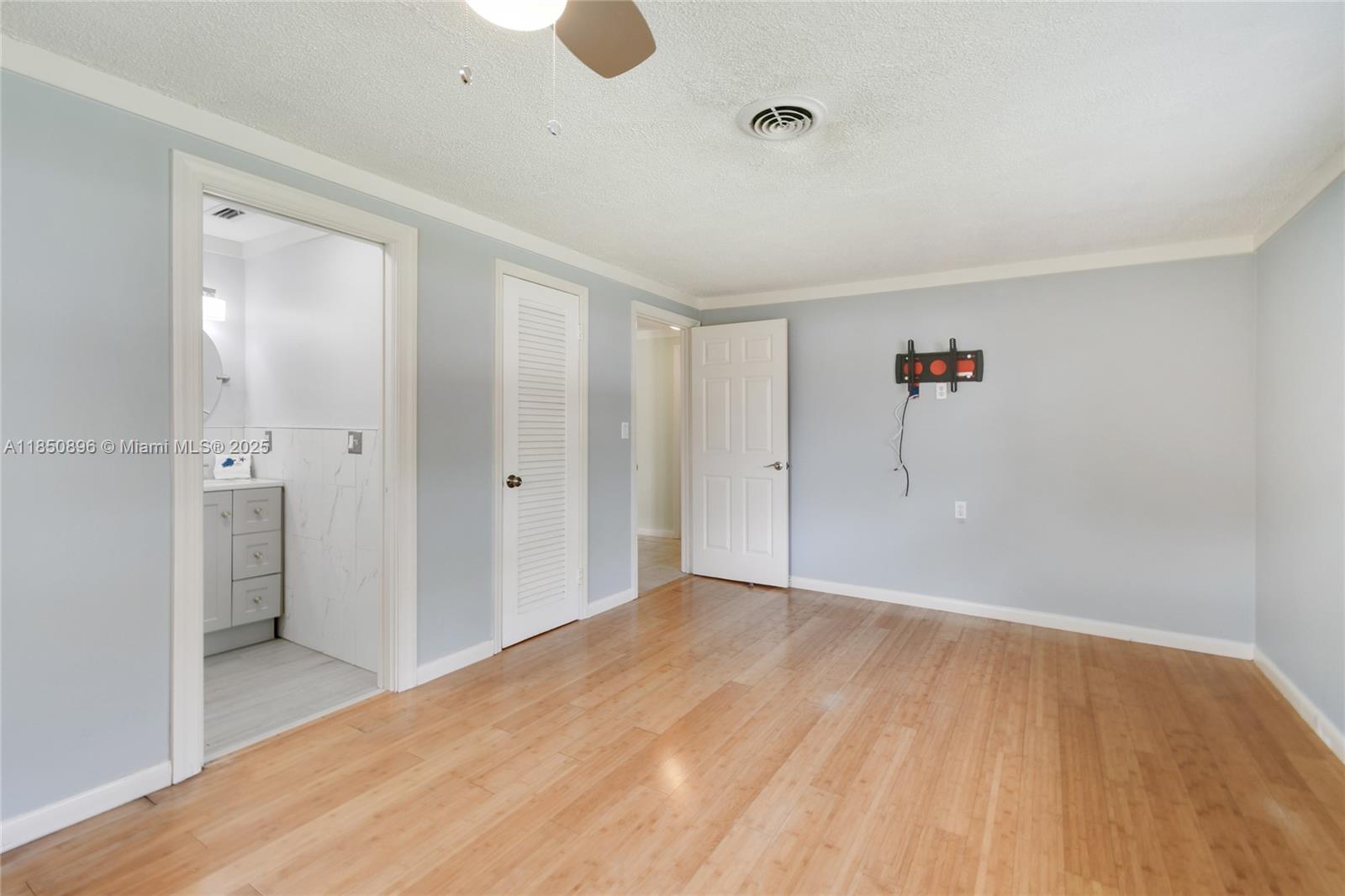110 Windsor Road East Jupiter, FL 33469 - Photo 20 of 30 a view of a big room with wooden floor and a bathroom