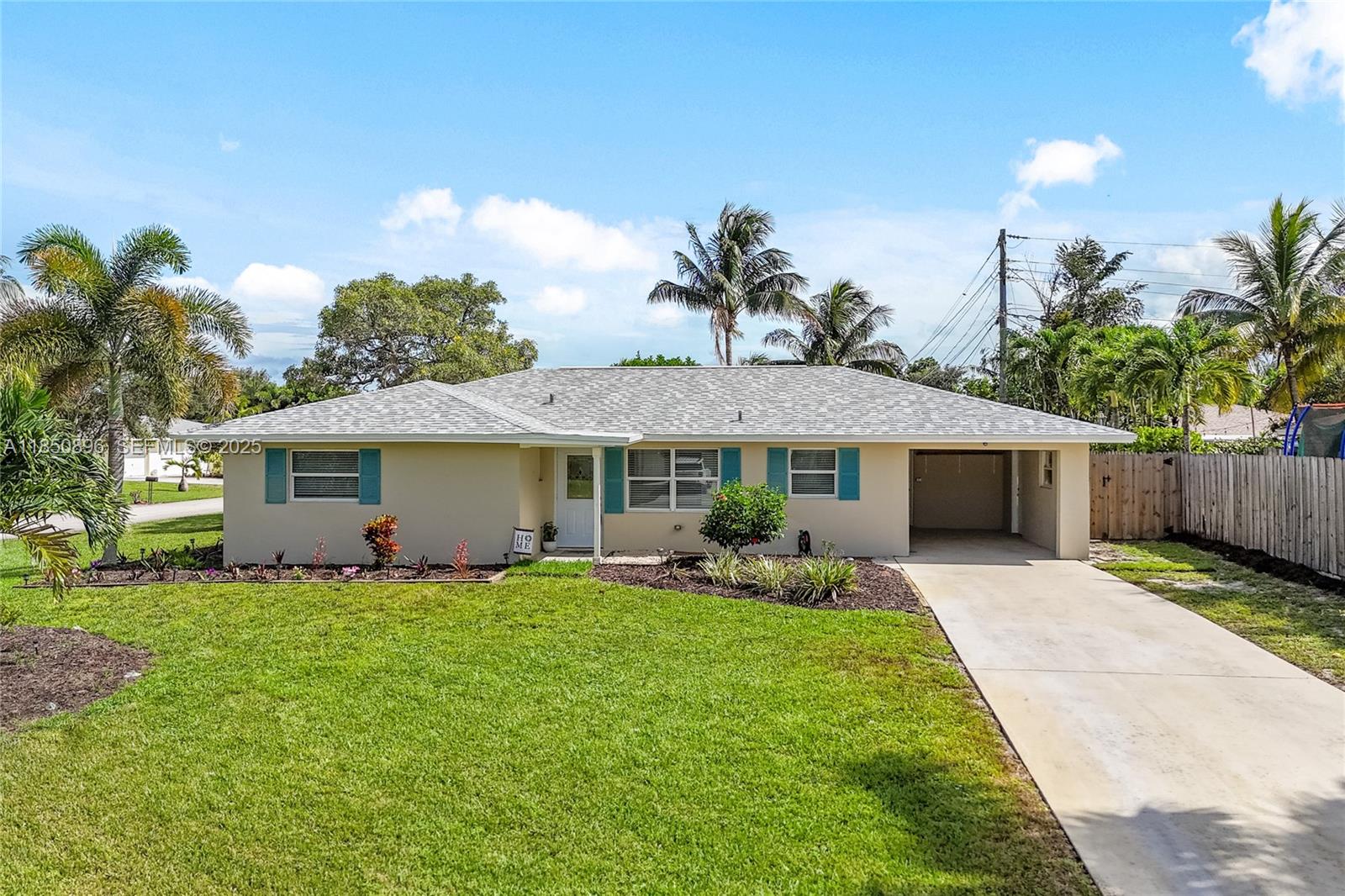 110 Windsor Road East Jupiter, FL 33469 - Photo 2 of 30 a front view of a house with garden