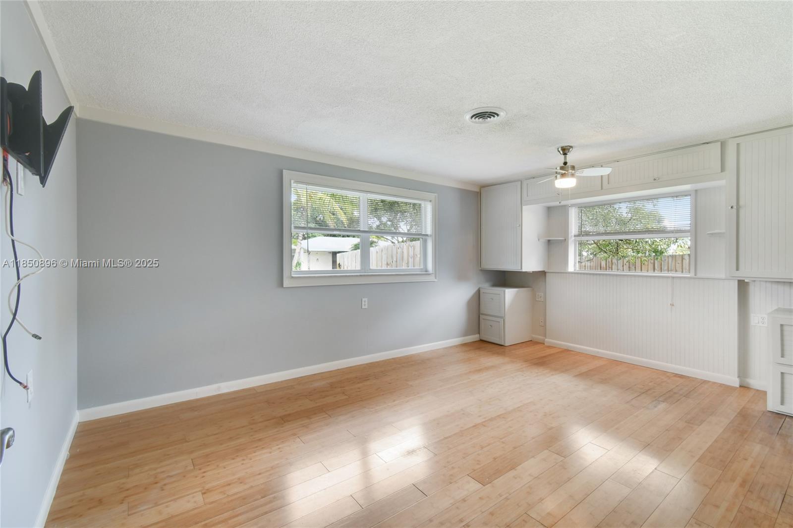 110 Windsor Road East Jupiter, FL 33469 - Photo 22 of 30 a view of an empty room with a window
